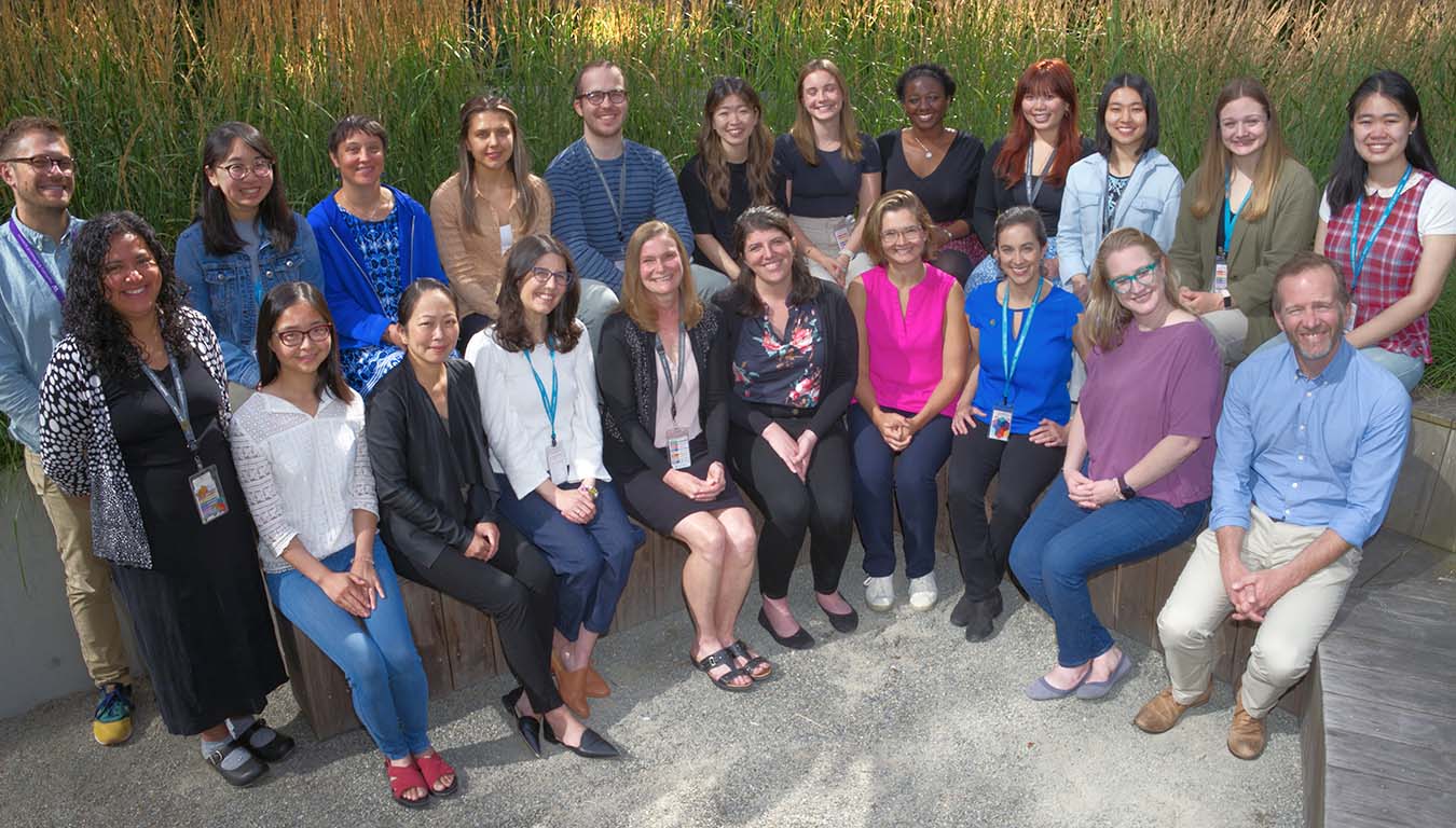 Group of the lab team members smiling outside