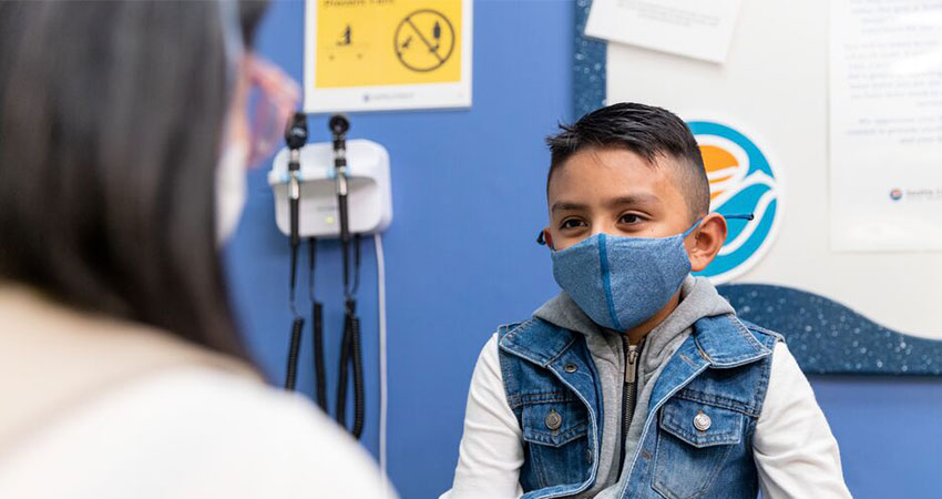 A boy in a mask at Seattle Children's