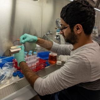 Man holding a test tube in the lab