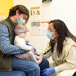 A Seattle Children's doctor examines a child