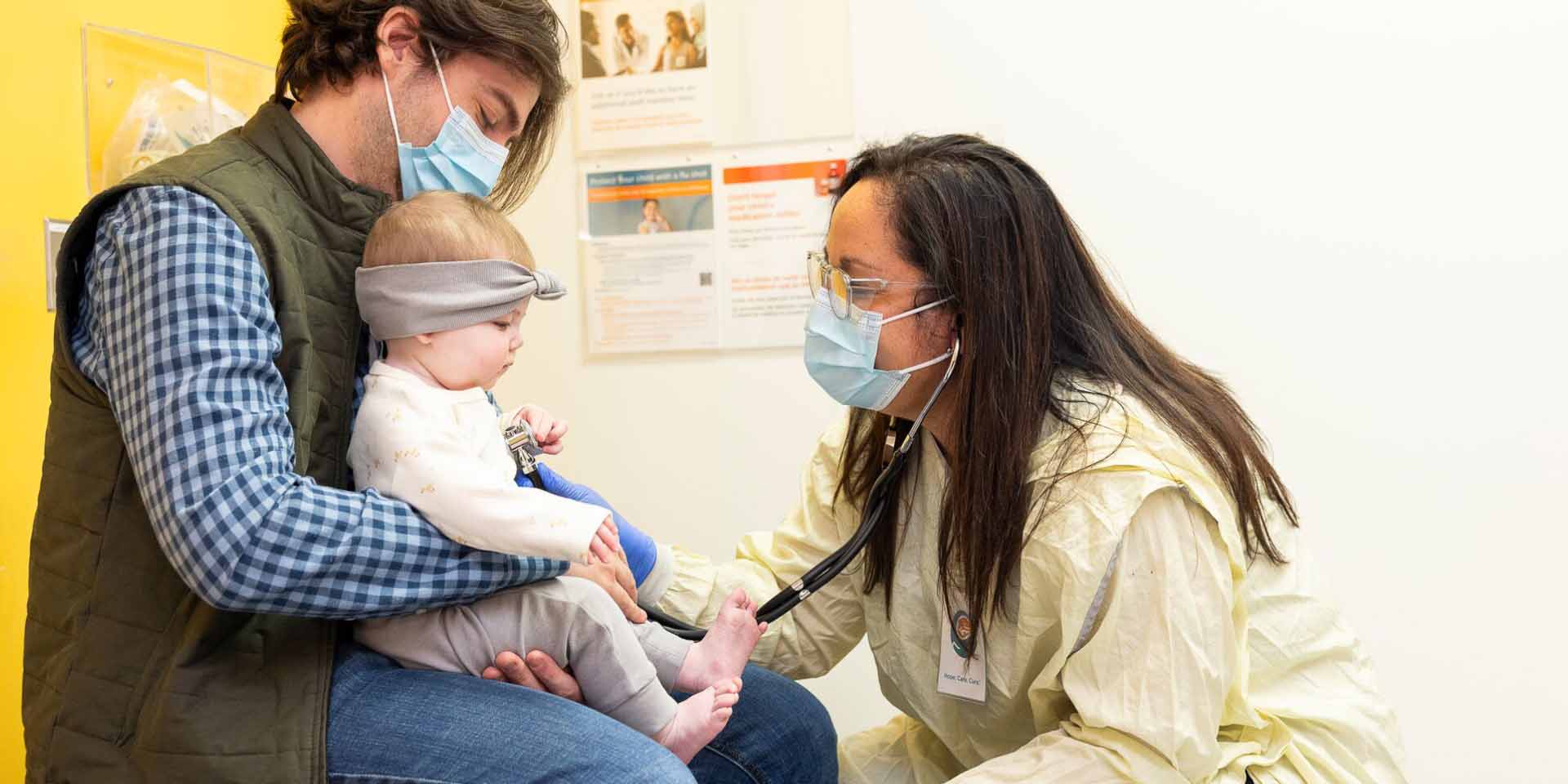 A Seattle Children's doctor examines a child