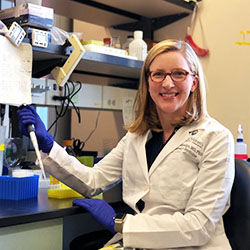 A researcher holding a tool