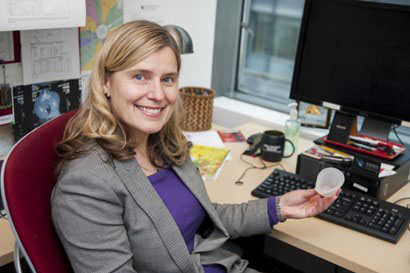 A smiling woman at a computer