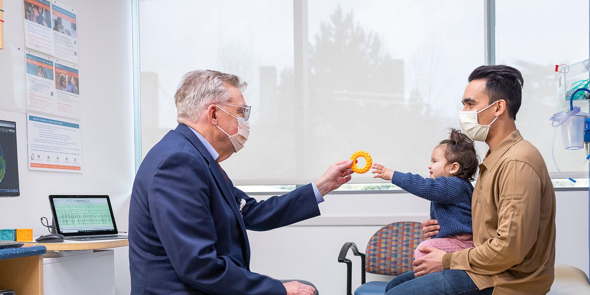 Dr. Rusty Novotny with patient and her father