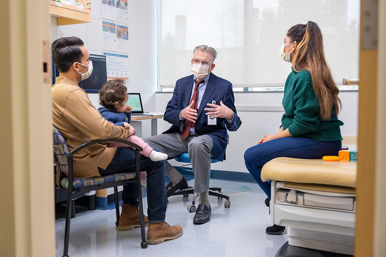 Seattle Children’s researcher Dr. Rusty Novotny with patient and her parents