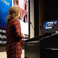A researcher gives a speech at a podium
