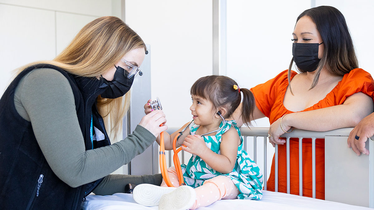 A girl is examined by a Seattle Children's provider