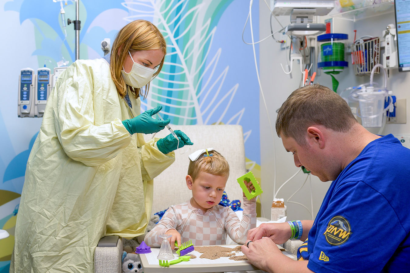 A nurse administers a CAR T cell therapy to a patient